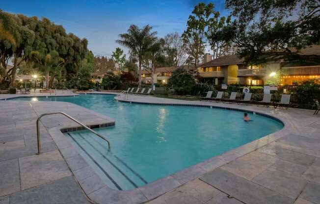 the swimming pool at the resort at dusk at Summerwood Apartments, Santa Clara