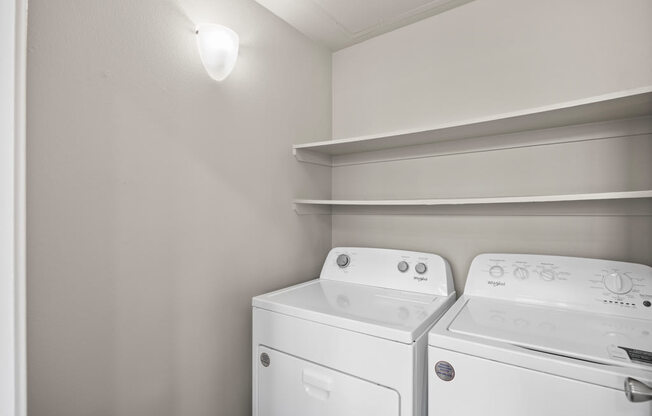 a white washer and dryer in a room