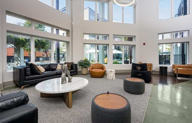 Lobby with seating and tables and lots of windows