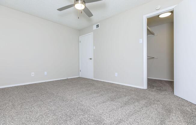 bedroom with open walk-in closet