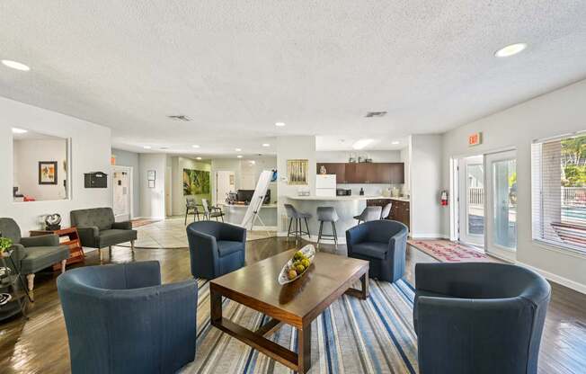 A living room with a dining table and chairs.