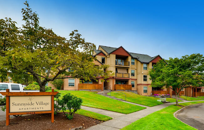 Apartments in Happy Valley for Rent - Sunnyside Village Apartments Exterior with Beautifully Landscaped Walkways