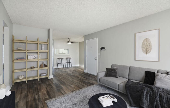 Model living room with view of kitchen bar