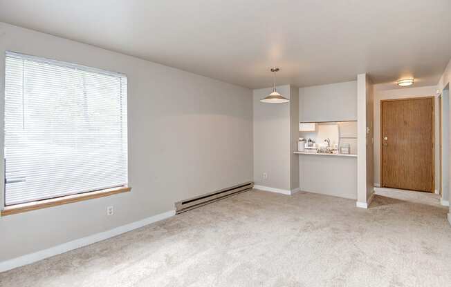 Seattle Apartments-  living area with natural light and kitchen