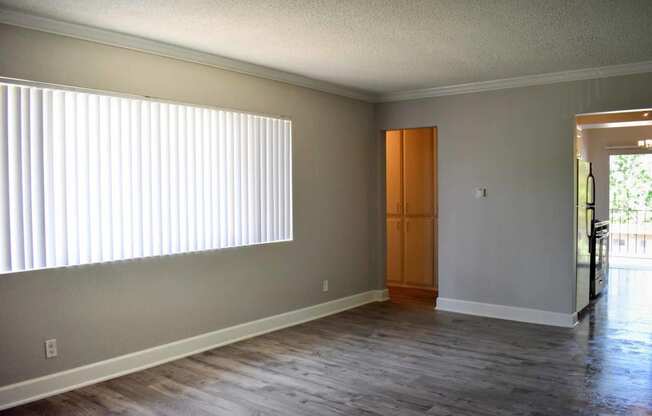 living room with wooden floors and big windows