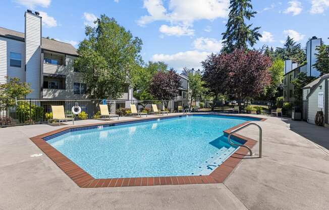 the preserve at ballantyne commons resort style swimming pool with trees and apartment buildings