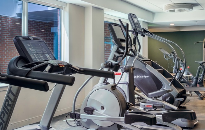 Cardio options include treadmills, ellipticals, StairMaster, row machine, and bikes