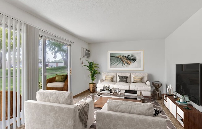 a living room with a couch and chairs and a television