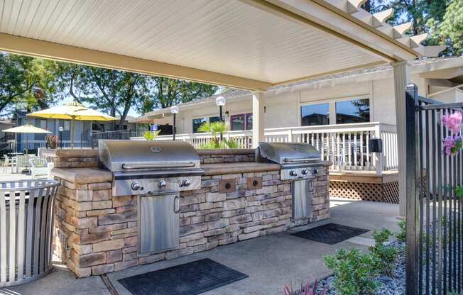 Community covered outdoor kitchen with two bbq grills at Renaissance Park Apartments, Davis, CA