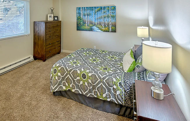 Three Bedroom Apartments in Renton WA - Sunset View - Wall-to-Wall Carpet, Large Window, Tall Dresser, and Dark Wood Night Stand