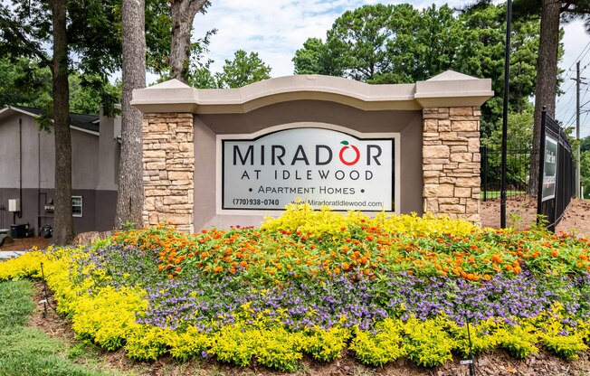 Mirador at Idlewood sign at the entrance of the community in Clarkston, Georgia, surrounded by landscaped greenery.