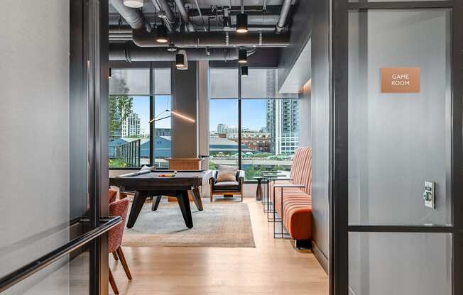 a conference room with a table and chairs and a view of the city  at Cassidy on Canal, Chicago, Illinois