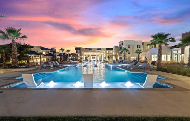 A large pool with a fountain in the middle of it.