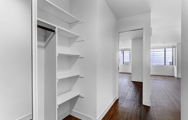 a walk in closet in a bedroom