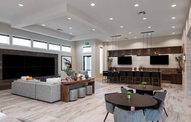 A modern living room with a fireplace and a dining area.