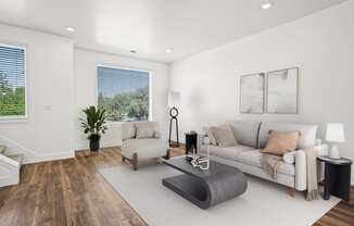 a living room with a couch and a chair at Aero Luxury Townhomes in Layton, UT