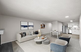 A modern living room with a grey sofa, a grey armchair, a grey coffee table, and a grey rug.