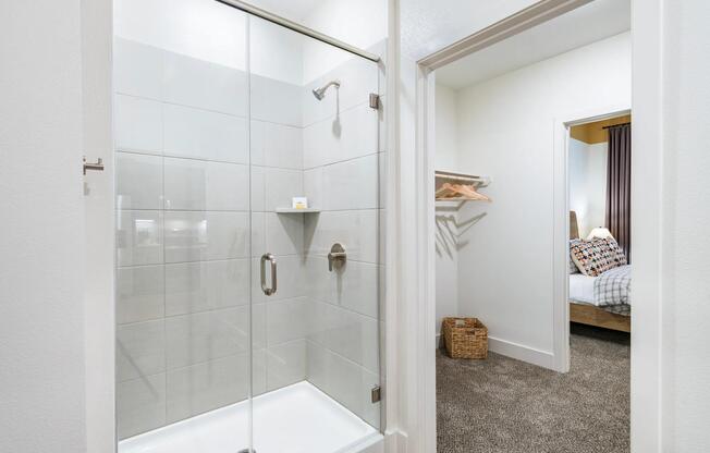 Unwind in luxury at Modera Garden Oaks with serene spa-like soaking tubs and stunning floor-to-ceiling tile shower surrounds—your perfect retreat from the everyday.