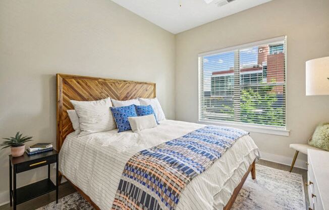 a bedroom with a large bed and a window at Link Apartments Innovation Quarter, Winston Salem, 27101