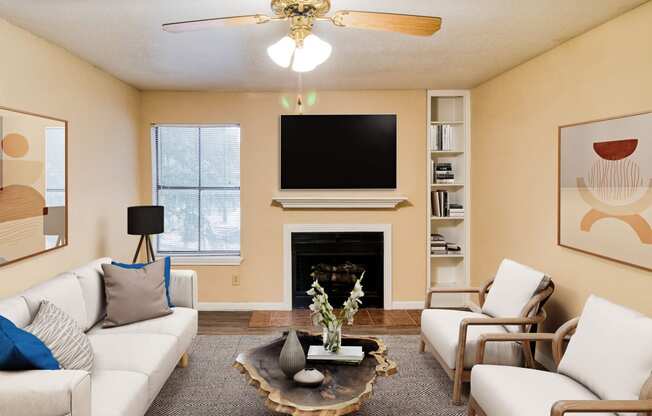 a living room with white couches and chairs and a fireplace with a flat screen tv above