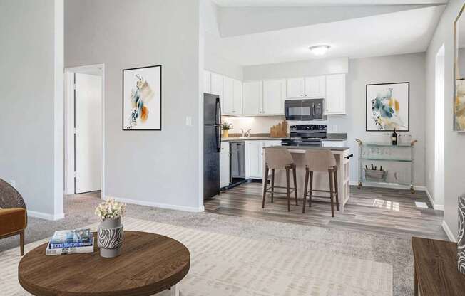 A modern kitchen with a dining table and chairs.