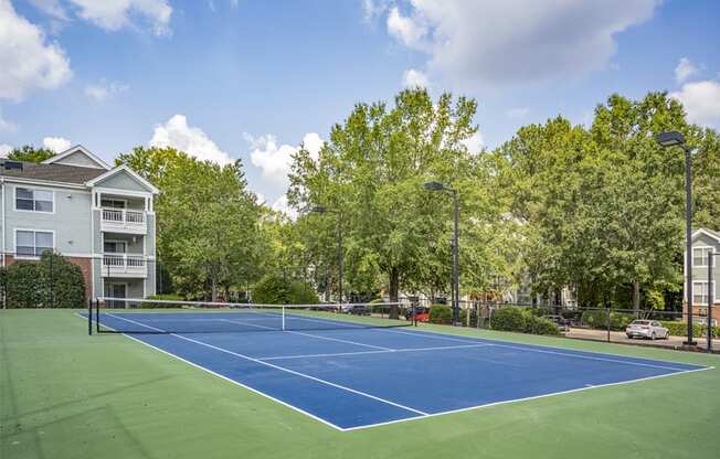 the preserve at ballantyne commons tennis court with apartments in the background