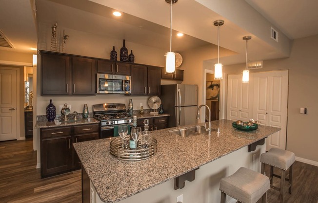 Kitchen with cabinets and appliances at Level 25 at Oquendo by Picerne, Las Vegas