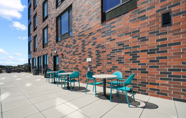 Exterior view of building and tables at The brick of Hackensack, Hackensack