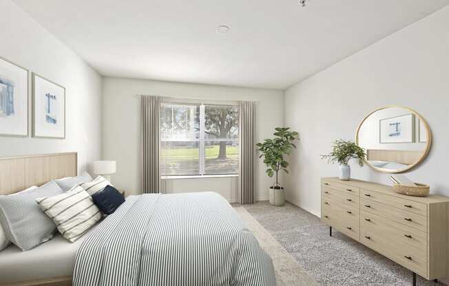 a bedroom with white walls and a large window