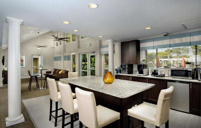 a kitchen and dining room with a granite counter top