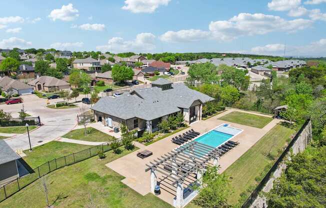 A large house with a pool in the backyard.