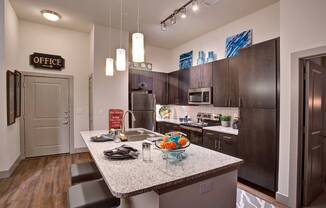 a kitchen with a granite counter top