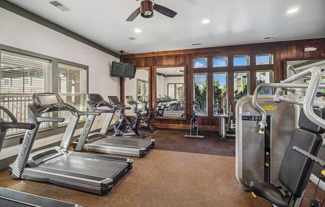 fitness center with cardio equipment at Berkshire Aspen Grove apartments