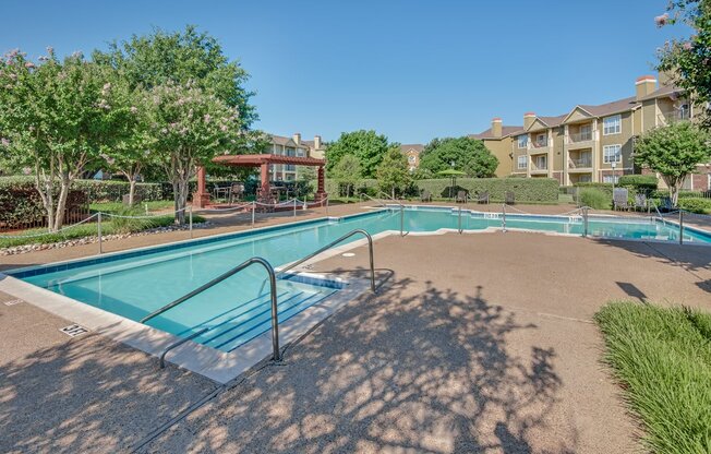 the preserve at ballantyne commons community pool and hot tub with apartment buildings in the background