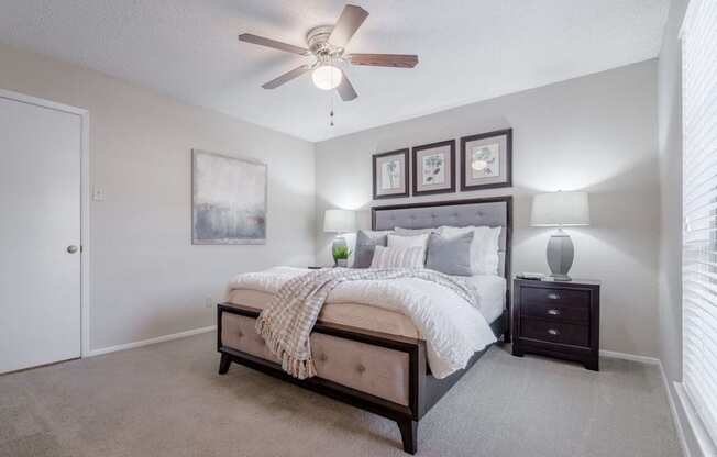 Large bedroom with ceiling fan  at Country Square, Carrollton, TX