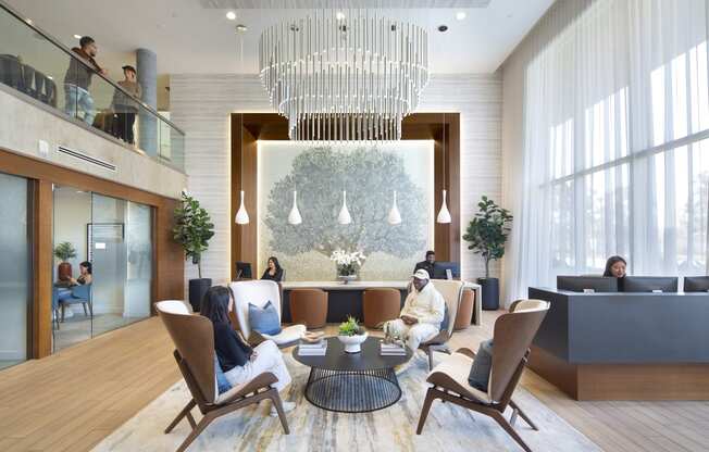 a rendering of a hotel lobby with a large chandelier and people in the background