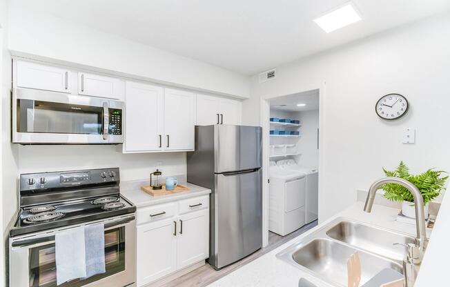 Kitchen equipped with stainless steel appliances at Rainbow Ridge Apartments in Kansas City, Kansas