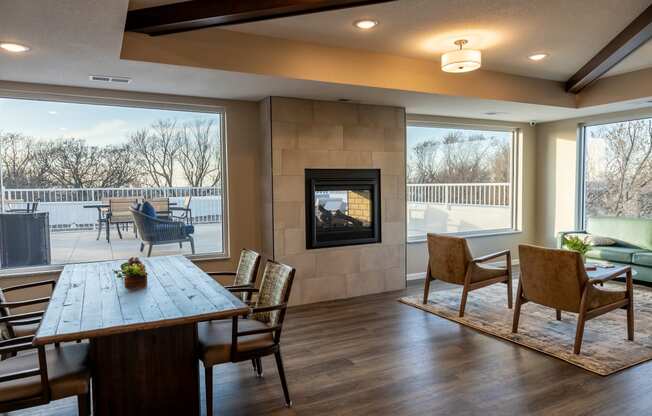 the retreat dining room with table and chairs and a fireplace