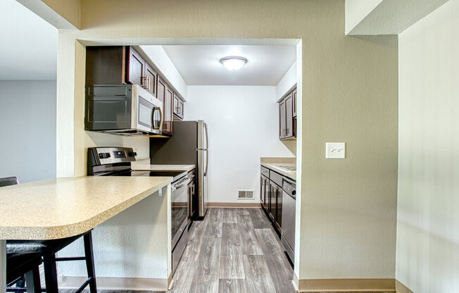 dining room brown cabinets stainless steel