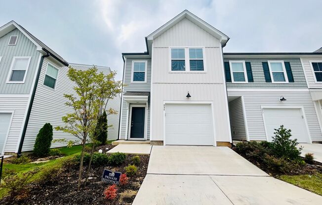 Stunning end-unit newly built 3 bedroom 2.5 bath townhouse in N High Point with attached garage.