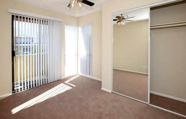 Bedroom with carpet and ceiling fan