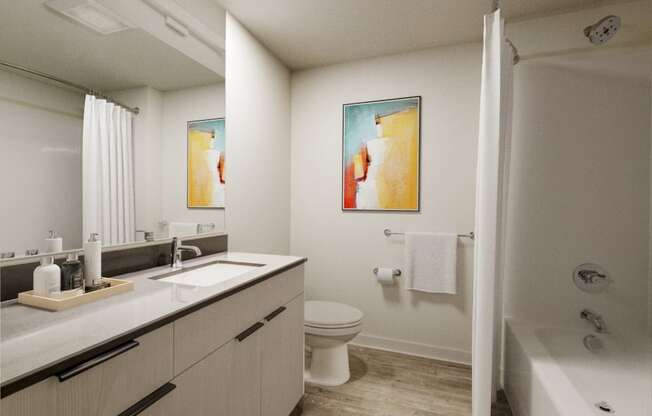 a bathroom with a toilet sink and bathtub at Marina Square, Bremerton, WA, 98337
