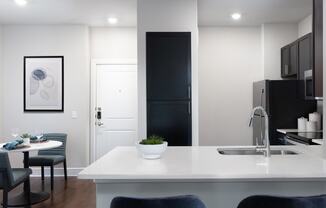 a kitchen and dining area in a 555 waverly unit