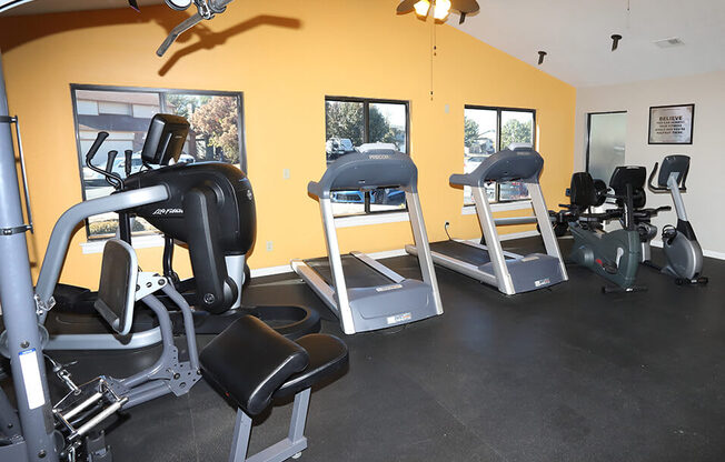 gym area with treadmills, weight machines, and more