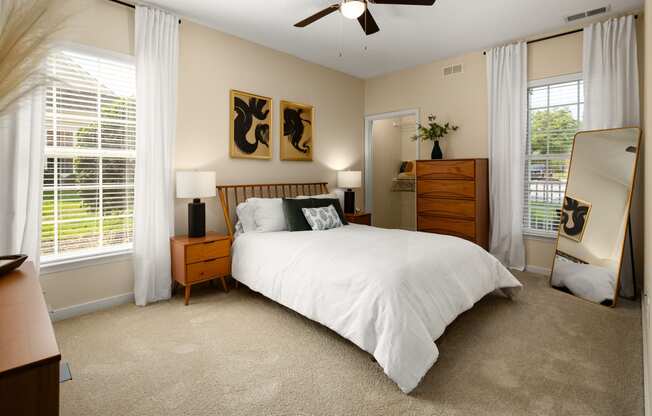 one of the bedrooms at the enclave at woodbridge apartments in sugar land, tx