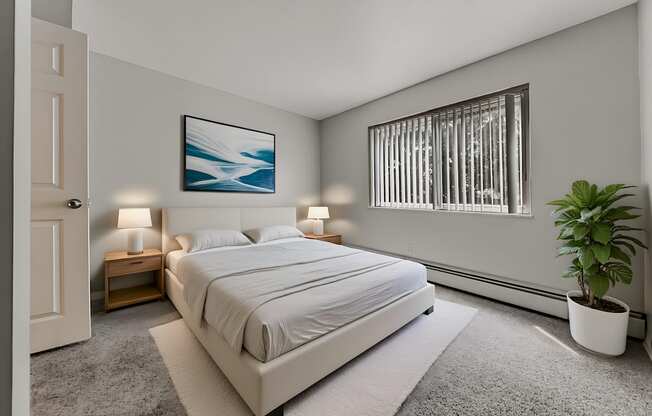 A bedroom with a large bed, a potted plant, and a painting on the wall.