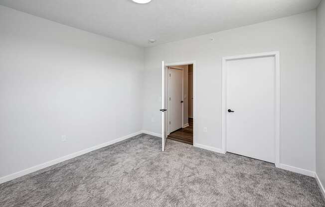 Studio, one two and three bedroom apartments and townhomes featuring open concept floor plans, dens, large windows, stainless steel appliances, quartz countertops, eat-in kitchens, pantries, LVT flooring and much more at The Trails at North Streams in Omaha, NE