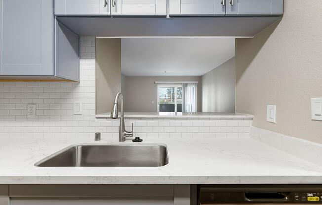 a kitchen with a sink and a microwave