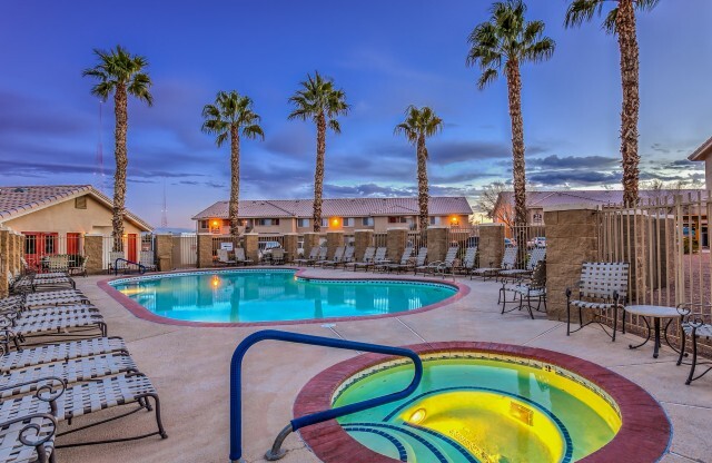 Las Vegas NV Apartments for Rent-Portola Del Sol Apartments Gated Pool With Hot Tub And Lounge Chairs And Palm Trees