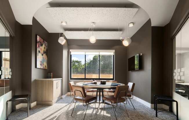 a conference room with a table and chairs and a window at 15 Bank Apartments, White Plains